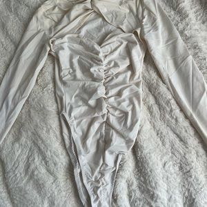White ruched-like bodysuit with heart shaped cut out detailing